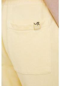 United Colors of Benetton spodnie dresowe bawełniane damskie kolor żółty gładkie. Stan: podwyższony. Kolor: żółty. Materiał: bawełna, dresówka. Wzór: gładki #3