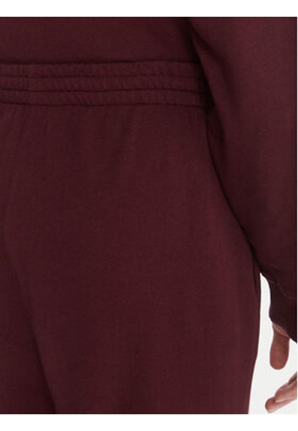 TOMMY HILFIGER - Tommy Hilfiger Spodnie dresowe UW0UW06081 Bordowy Wide Leg. Kolor: czerwony. Materiał: bawełna