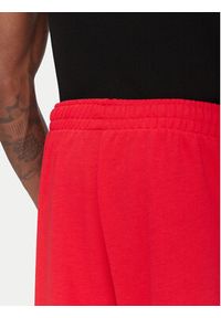 Adidas - adidas Spodnie dresowe Essentials JF3601 Czerwony Loose Fit. Kolor: czerwony. Materiał: bawełna #4
