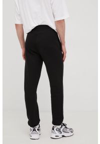New Era spodnie dresowe męskie kolor czarny z nadrukiem. Kolor: czarny. Materiał: dresówka. Wzór: nadruk