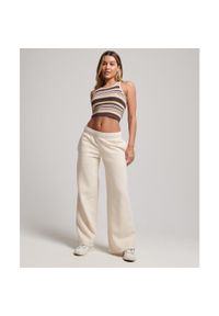 Damskie proste spodnie dresowe w odcieniu wyblakłym Superdry. Kolor: szary. Materiał: dresówka. Długość: długie #2