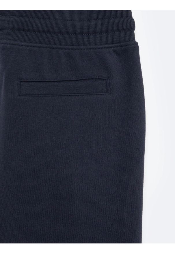 Big-Star - Spodnie chłopięce dresowe granatowe Letterp 403. Kolor: niebieski. Materiał: dresówka. Styl: młodzieżowy, retro, sportowy, elegancki