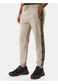 Guess Spodnie dresowe Z2YB19 K6ZS1 Beżowy Regular Fit. Kolor: beżowy. Materiał: bawełna #1