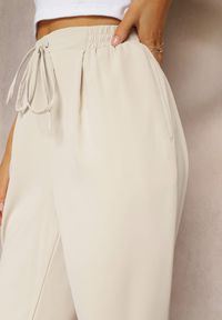 Renee - Beżowe Spodnie High Waist z Gumką i Troczkiem w Pasie oraz Kieszeniami Arlettia. Stan: podwyższony. Kolor: beżowy. Materiał: tkanina. Długość: długie. Wzór: jednolity #4