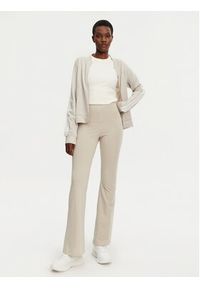 Adidas - adidas Legginsy Essentials Small Logo JD3072 Beżowy Flare Fit. Kolor: beżowy. Materiał: bawełna #3