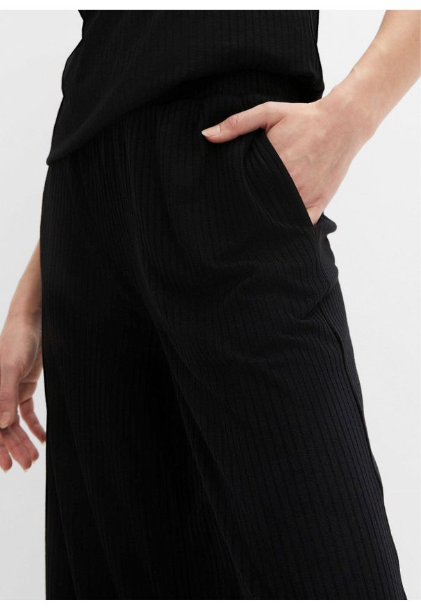 bonprix - Spodnie z prążkowanego dżerseju z elastyczną gumką w talii. Kolor: czarny. Materiał: prążkowany, jersey. Wzór: prążki