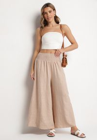 Born2be - Beżowe Spodnie Szerokie z Szeroką Gumką w Talii Koririelle. Okazja: na co dzień. Kolor: beżowy. Styl: elegancki, casual #6