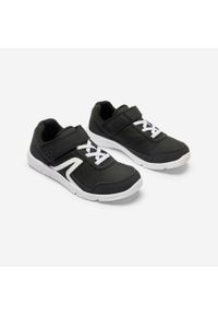Decathlon - Buty sportowe dla dzieci Newfeel PW 100. Zapięcie: rzepy. Kolor: biały, wielokolorowy, czarny. Materiał: kauczuk. Szerokość cholewki: normalna