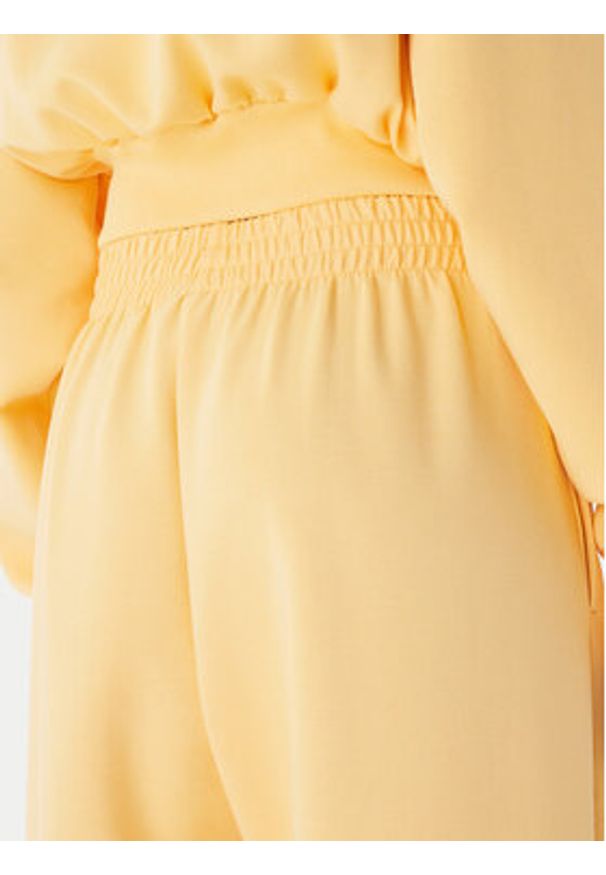 Adidas - adidas Spodnie dresowe Soft Lux KA7020 Pomarańczowy Loose Fit. Kolor: pomarańczowy. Materiał: syntetyk