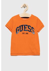 Guess t-shirt bawełniany dziecięcy kolor pomarańczowy wzorzysty. Okazja: na co dzień. Kolor: pomarańczowy. Materiał: bawełna. Wzór: haft. Styl: casual
