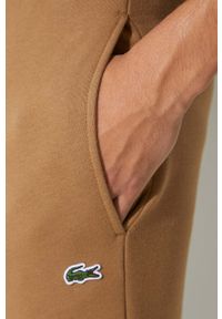 Lacoste spodnie dresowe męskie kolor brązowy gładkie. Kolor: brązowy. Materiał: dresówka. Wzór: gładki #4
