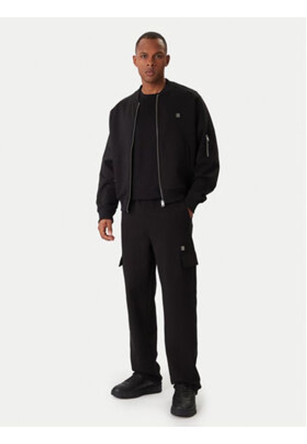 Hugo - HUGO Spodnie dresowe Danovopan 50546376 Czarny Relaxed Fit. Kolor: czarny. Materiał: bawełna