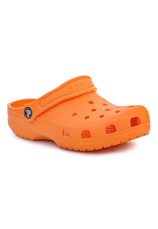 Klapki Crocs Classic Kids Clog 206991-83A pomarańczowe. Okazja: na plażę, na co dzień. Kolor: pomarańczowy. Materiał: syntetyk. Styl: klasyczny, wakacyjny, casual
