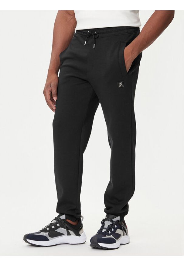 Hugo - HUGO Spodnie dresowe Dimacs 50533695 Czarny Relaxed Fit. Kolor: czarny. Materiał: bawełna