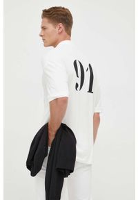 Armani Exchange polo bawełniane kolor beżowy z nadrukiem. Typ kołnierza: polo. Kolor: beżowy. Materiał: bawełna. Długość: krótkie. Wzór: nadruk