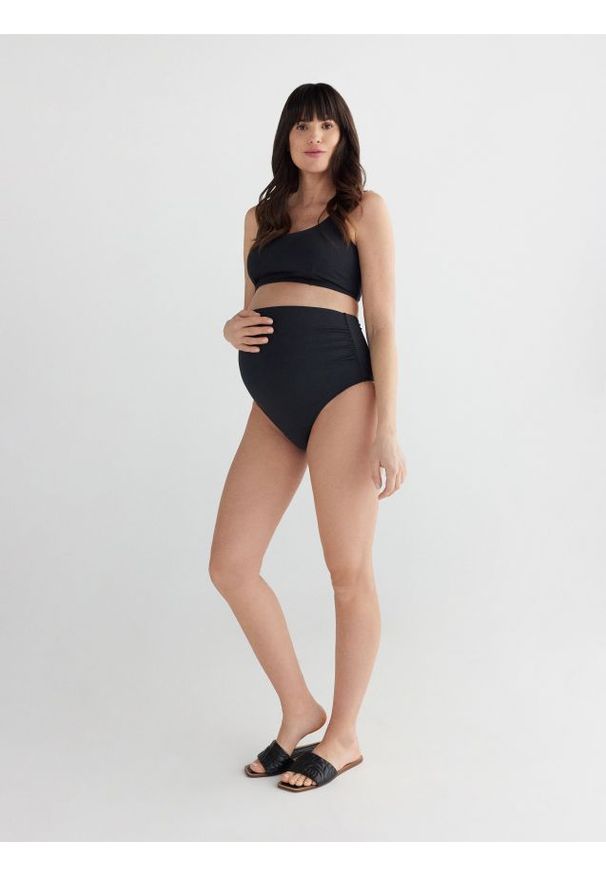 Reserved - Dół bikini z ochroną UV - czarny. Kolor: czarny. Materiał: dzianina. Wzór: gładki