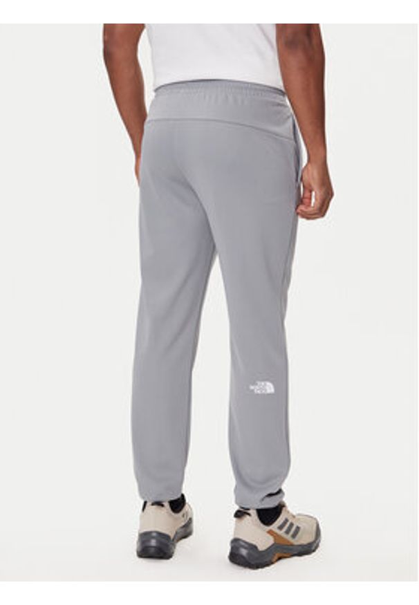 The North Face Spodnie dresowe Reaxion 2.0 NF0A8DRS Szary Regular Fit. Kolor: szary. Materiał: syntetyk