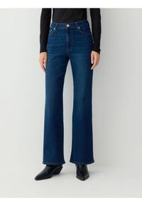 Reserved - Jeansy bootcut - granatowy. Kolor: niebieski