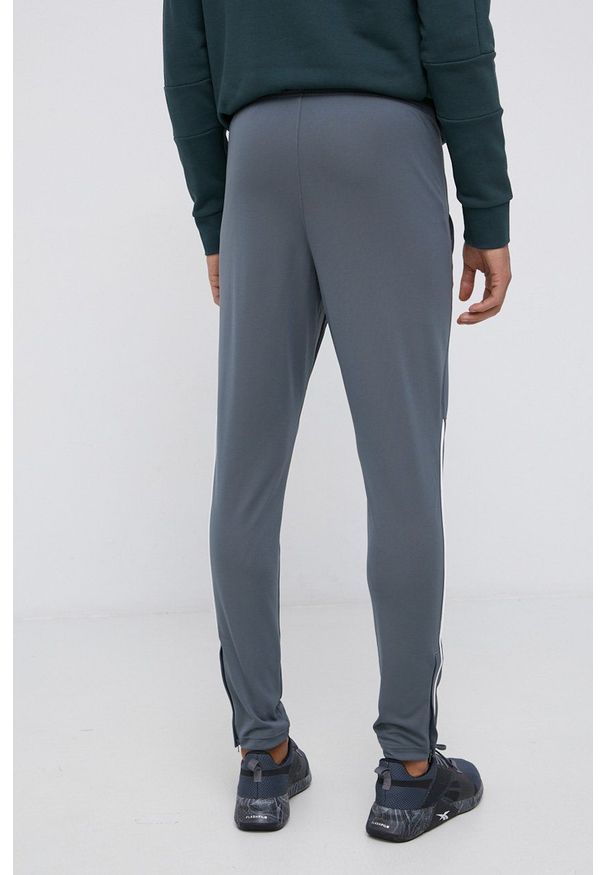 Under Armour - Spodnie. Kolor: szary. Materiał: materiał