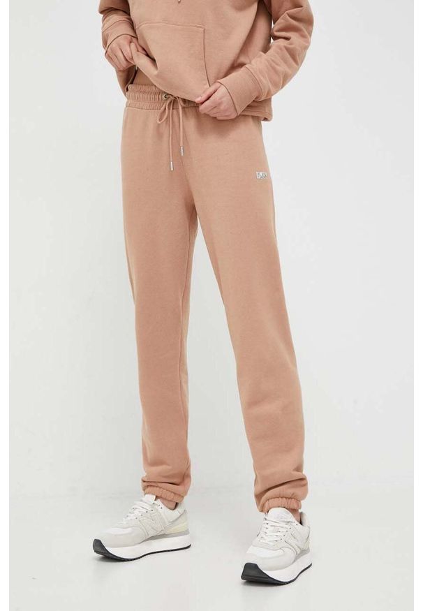 DKNY - Dkny spodnie dresowe kolor brązowy gładkie. Kolor: brązowy. Materiał: dresówka. Wzór: gładki