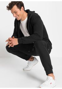 bonprix - Spodnie sportowe z modnymi szczegółami. Kolor: czarny. Styl: sportowy #3