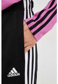Adidas - adidas spodnie dresowe damskie kolor czarny z aplikacją. Kolor: czarny. Materiał: dresówka. Wzór: aplikacja #3