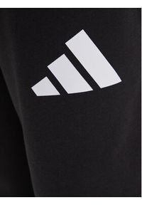 Adidas - adidas Spodnie dresowe Essentials JF3567 Czarny Loose Fit. Kolor: czarny. Materiał: bawełna #3