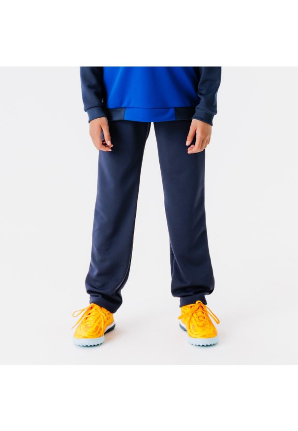 KIPSTA - Spodnie piłkarskie dla dzieci Kipsta Essential Club. Kolor: niebieski. Materiał: poliester, materiał. Sport: piłka nożna