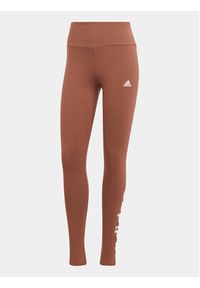 Adidas - adidas Legginsy ESSENTIALS HIGH-WAISTED LOGO IM2858 Brązowy Tight Fit. Kolor: brązowy. Materiał: bawełna