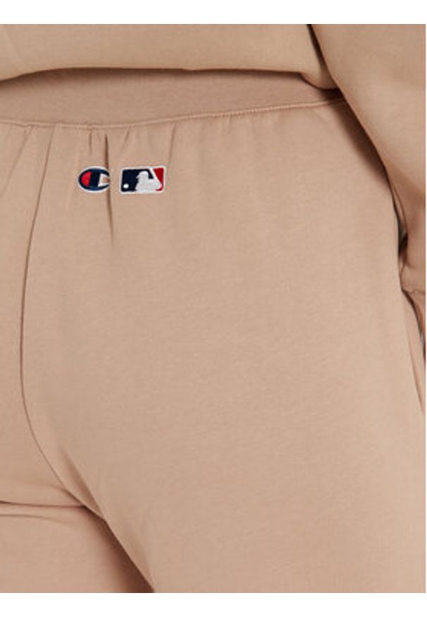 Champion Spodnie dresowe 117510 Beżowy Regular Fit. Kolor: beżowy. Materiał: bawełna