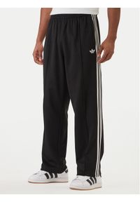 Adidas - adidas Spodnie dresowe adicolor KE3501 Czarny Loose Fit. Kolor: czarny. Materiał: bawełna #1