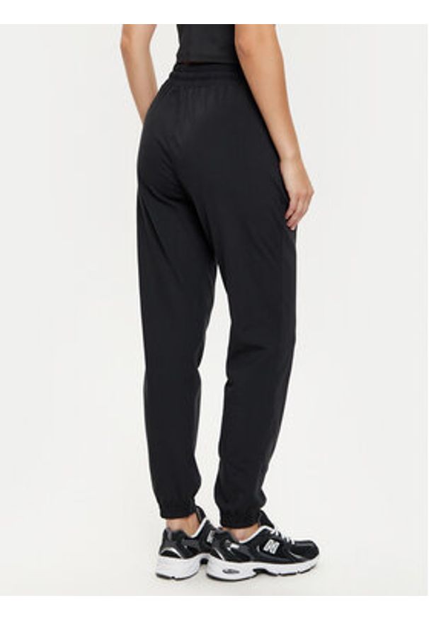 GIRLFRIEND COLLECTIVE - Girlfriend Collective Spodnie dresowe ReSet 6016 Czarny Slim Fit. Kolor: czarny. Materiał: syntetyk