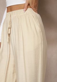 Renee - Beżowe Spodnie o Szerokim Kroju High Waist z Wiązaniem Fenalin. Okazja: na co dzień, na imprezę, na spacer. Stan: podwyższony. Kolor: beżowy. Styl: casual, elegancki