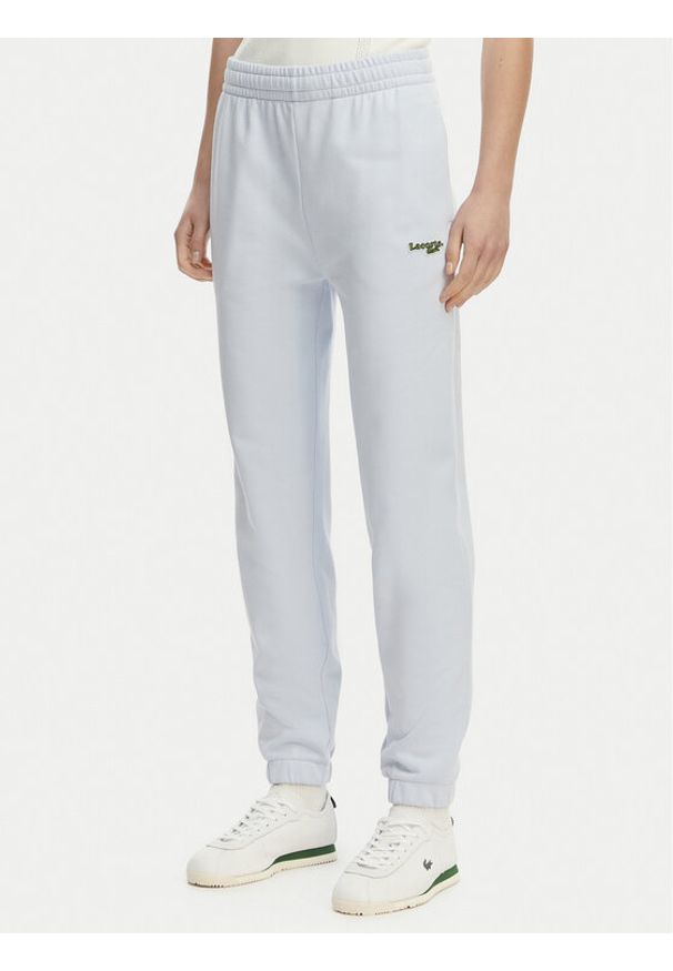 Lacoste Spodnie dresowe XF7604 Niebieski jasny Regular Fit. Kolor: niebieski. Materiał: bawełna