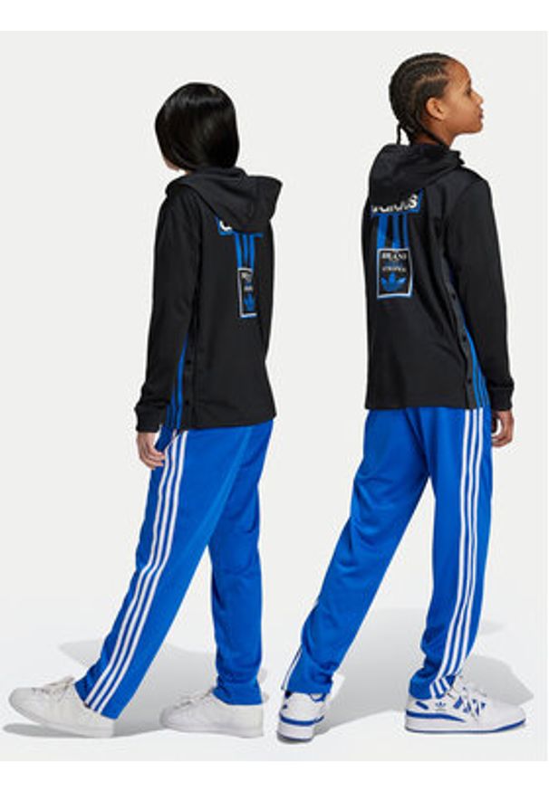 Adidas - adidas Spodnie dresowe Firebird IY9803 Niebieski Regular Fit. Kolor: niebieski. Materiał: syntetyk