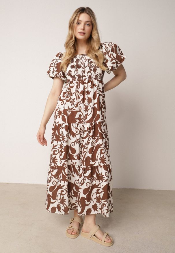 Born2be - Brązowa Rozkloszowana Sukienka z Wiskozy z Bufiastymi Rękawami w Roślinny Wzór Semea. Okazja: do pracy, na co dzień, na spotkanie biznesowe. Kolor: brązowy. Materiał: wiskoza. Sezon: lato. Typ sukienki: proste, rozkloszowane. Styl: biznesowy, casual. Długość: maxi
