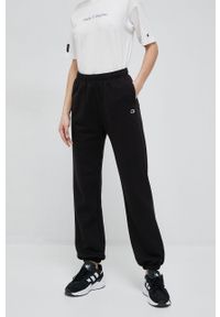 Champion spodnie dresowe kolor czarny gładkie. Kolor: czarny. Materiał: dresówka. Wzór: gładki #5