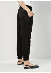 Ochnik - Czarne spodnie damskie ze ściągaczami. Kolor: czarny