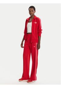 Adidas - adidas Spodnie dresowe adicolor Classic Firebird JW1225 Czerwony Loose Fit. Kolor: czerwony. Materiał: syntetyk #5