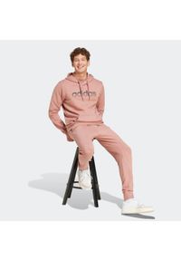 Adidas - Spodnie dresowe męskie ADIDAS. Kolor: różowy. Materiał: dresówka. Sport: joga i pilates