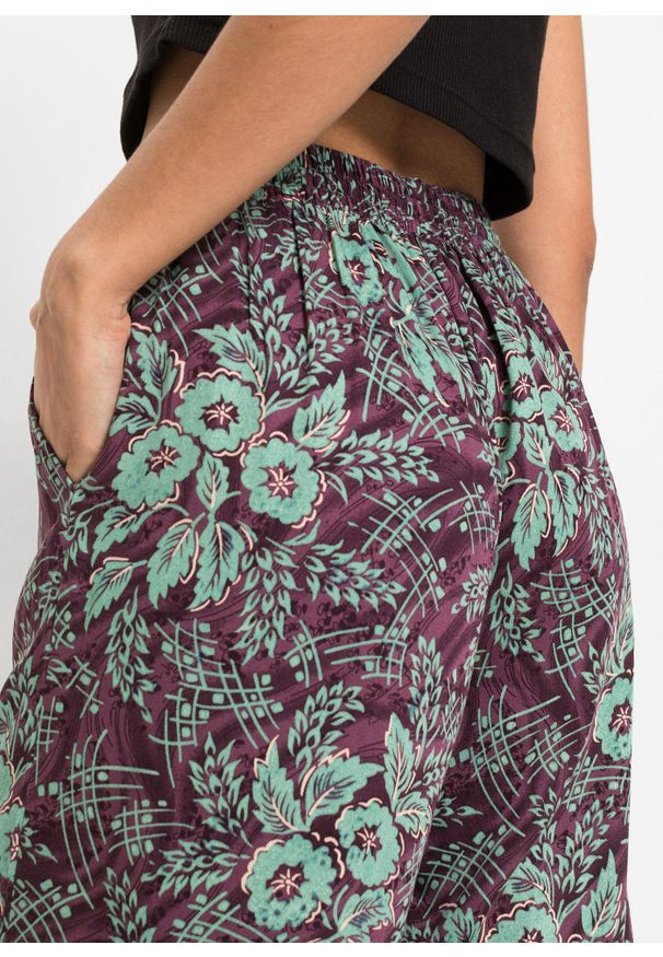 bonprix - Spodnie palazzo z lejącej wiskozy. Kolor: fioletowy. Materiał: materiał, wiskoza. Wzór: nadruk