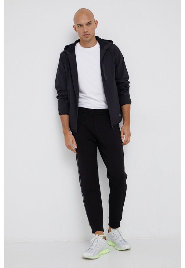 Emporio Armani - Spodnie. Kolor: czarny. Materiał: dzianina. Wzór: aplikacja