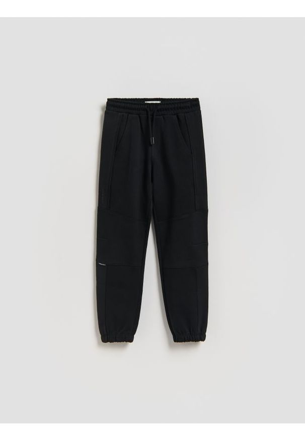 Reserved - Bawełniane spodnie jogger - czarny. Kolor: czarny. Materiał: bawełna