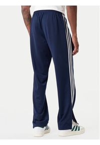 Adidas - adidas Spodnie dresowe Firebird KD8316 Granatowy Loose Fit. Kolor: niebieski. Materiał: syntetyk #4