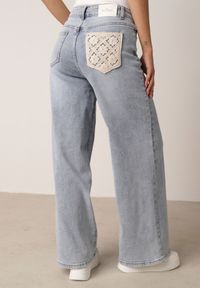 Born2be - Niebieskie Jeansy o Szerokim Fasonie z Wysokim Stanem Zdobione Haftem Liluth. Okazja: na co dzień, na spotkanie biznesowe, do pracy. Stan: podwyższony. Kolor: niebieski. Wzór: aplikacja, haft. Styl: casual, biznesowy, elegancki, klasyczny #7