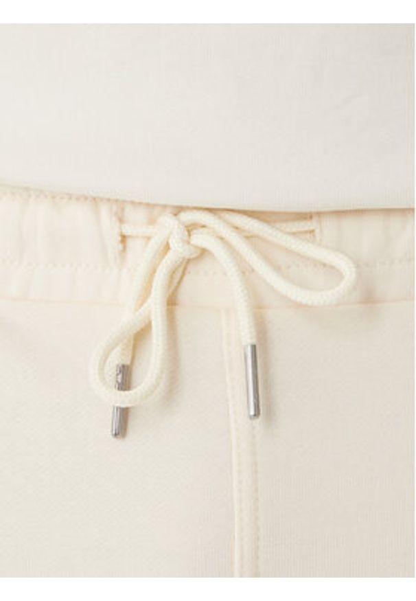 Calvin Klein Jeans Spodnie dresowe Monogram LV047F210G Beżowy Regular Fit. Kolor: beżowy. Materiał: bawełna