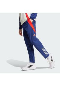 Adidas - Spodnie Olympique Lyonnais Tiro 24 Presentation. Kolor: czerwony, niebieski, wielokolorowy, biały. Materiał: dresówka, materiał. Sport: piłka nożna #1