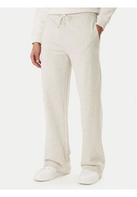 Calvin Klein Jeans Spodnie dresowe Embossed Monologo LV047F206G Beżowy Wide Leg. Kolor: beżowy. Materiał: bawełna #1