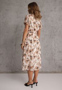 Renee - Pomarańczowa Kopertowa Sukienka z Wiązanym Paskiem w Kwiatowy Print z Brokatem Runewea. Okazja: na randkę. Kolor: pomarańczowy. Wzór: nadruk, kwiaty. Typ sukienki: kopertowe. Styl: boho #4