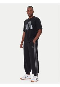 Adidas - adidas Spodnie dresowe Ess JM1703 Czarny Regular Fit. Kolor: czarny. Materiał: bawełna